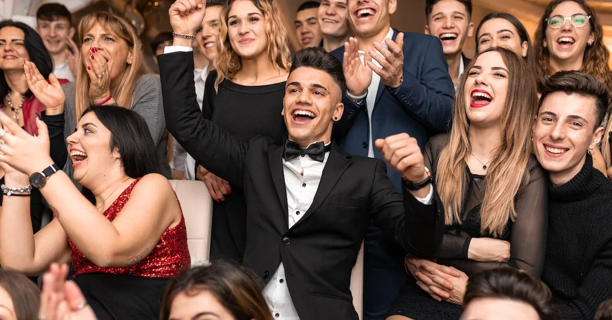 A group of young adults dressed up very nice and celebrating. They are all smiling. Are you ready to improve your dental care? Lear how in our latest article.