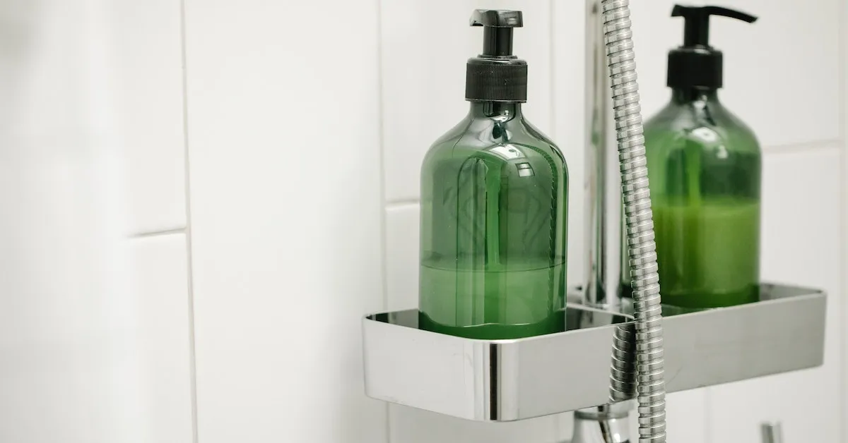 There are two green unlabled bottles for shampoo and conditioner. They are in a stainless steel holder on the shower wall. Learn how to save money in this article about body wash and shampoo.