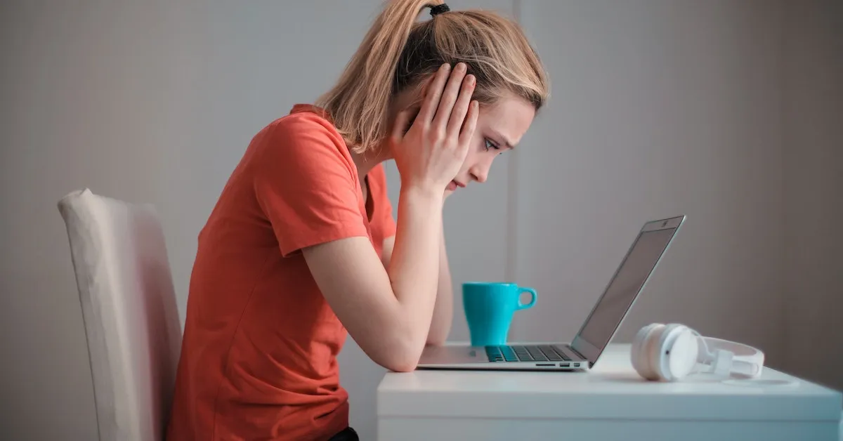 A woman staring into a laptop computer showing frustration. Learn a unique solution to a Windows Security problem.