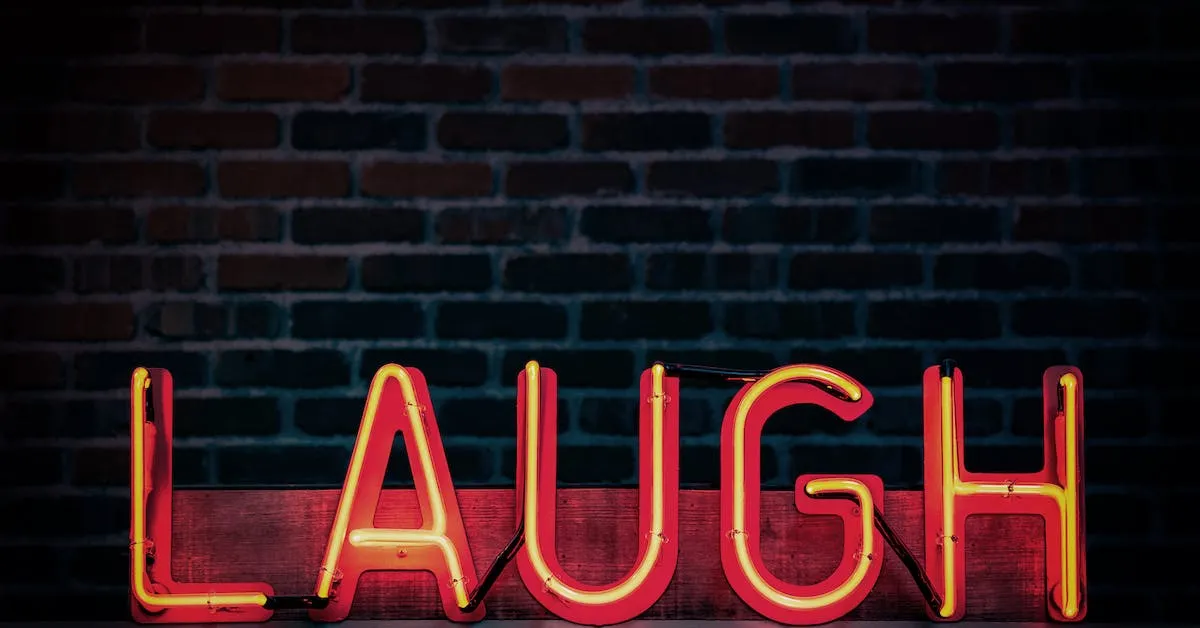 A large, red neon sign that shows the word: LAUGH. A large video collection of clean comedy that you and your whole family will enjoy!