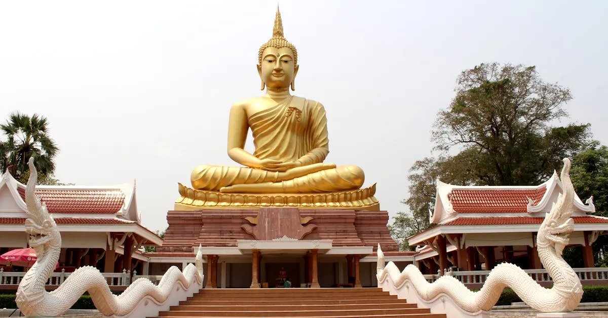 A large golden Buddha statute above a temple. What is true religion?