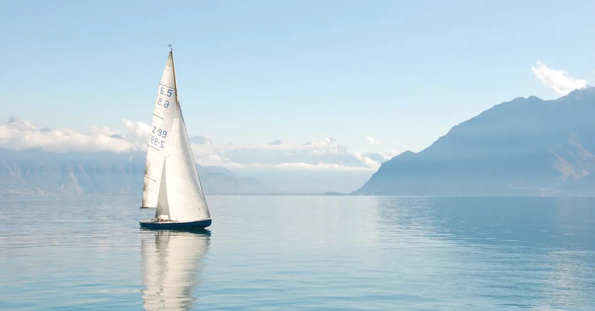 A large sailboat with a white sail. It is a beautiful day with a blue sky and some mountains in the background. Find rest when we trust in God.