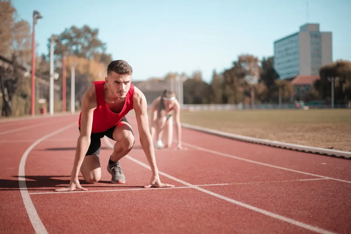 A man with a red shirt is on a track about to run but he appear to hesitate. Sometimes life can be very challenging and we become emotionally drained and ready to give up. In this latest article you'll find encouragement to NOT GIVE UP and stay focused on your goals with help from God.