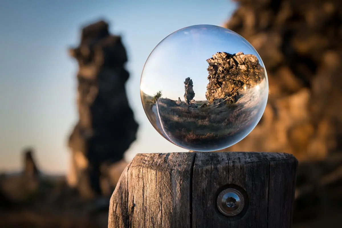 A glass sphere reflecting an image of the outside world. Focusing on the image in the sphere can cause us to consider our perspective on life. What's your perspective on life lately? Read why a fresh perspective can be very helpful in our latest article.